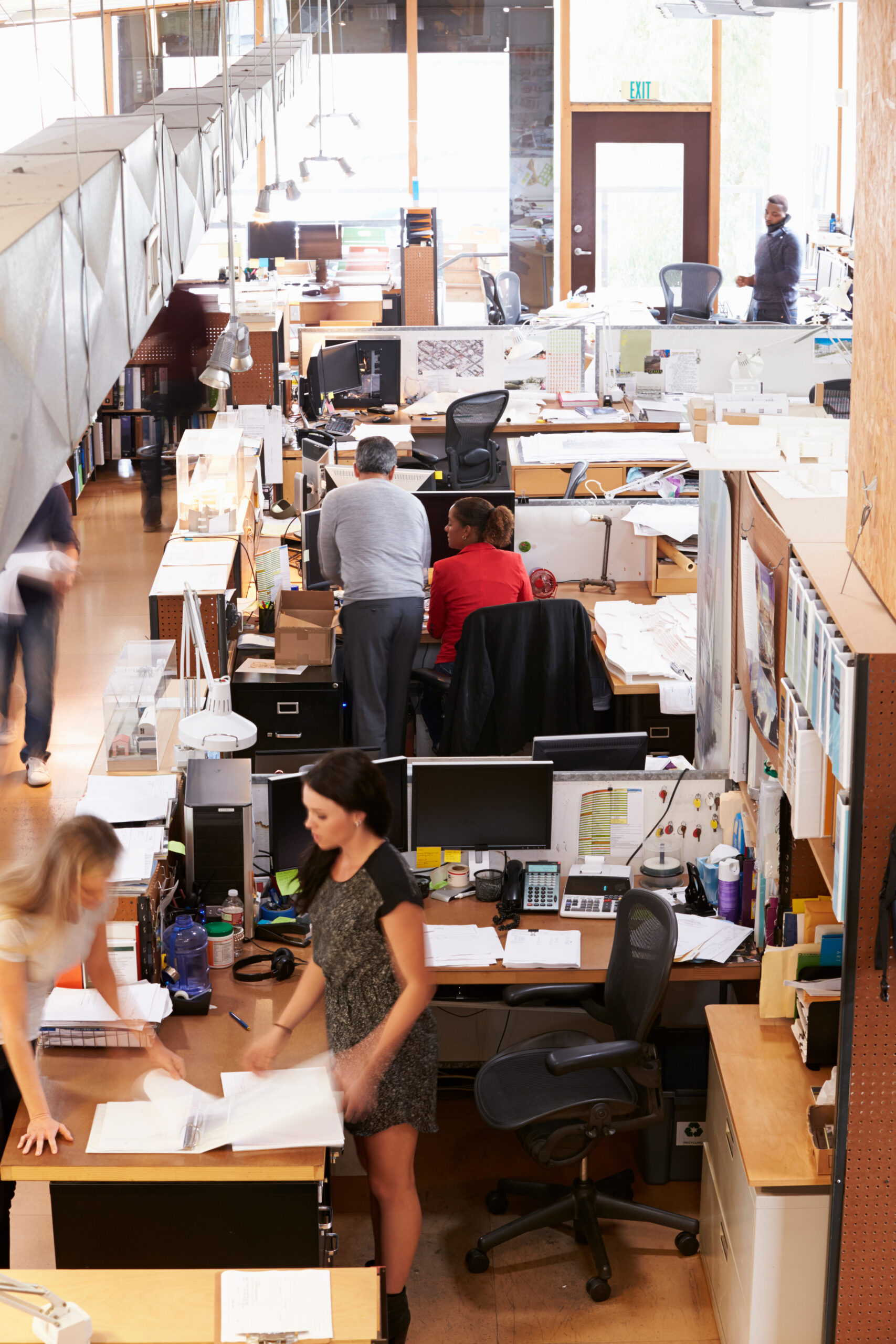 Interior Of Busy Architect’s Office With Staff Working