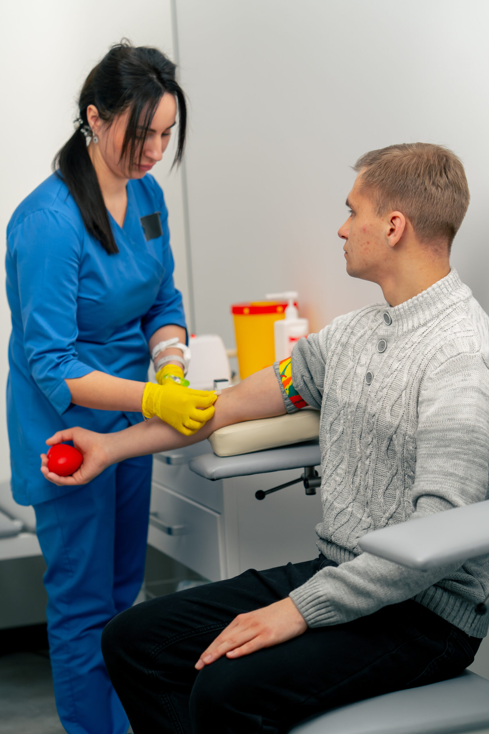 in the clinic a guy asks a doctor with a blue form for blood tests healthy lifestyle